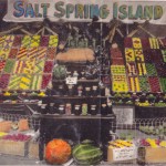 A coloured display of Salt Spring produce at the Saanich (Victoria) Fall Fair - 1918. NOTE: Since this photo was originally taken as a black and white, recently a local artist used watercolour to paint in the colour. The colour patterns stand out so well.