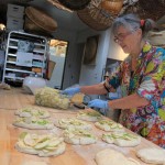 Heather, the Bread Lady baking apple laden focaccia for Apple Festival 2011. Her mouth watering breads and baked treats are all baked in a wood fired oven. A must to see and taste. http://www.phillipvanhorndesign.com/bakery/index.html Photo by Karen Mouat