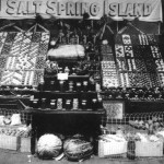A display of Salt Spring produce at the Saanich (Victoria) Fall Fair - 1918. Note the geometrical arrangements of the various colours of apples to make such great colour patterns.
